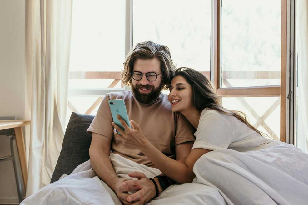 Cute couple in bed cuddling