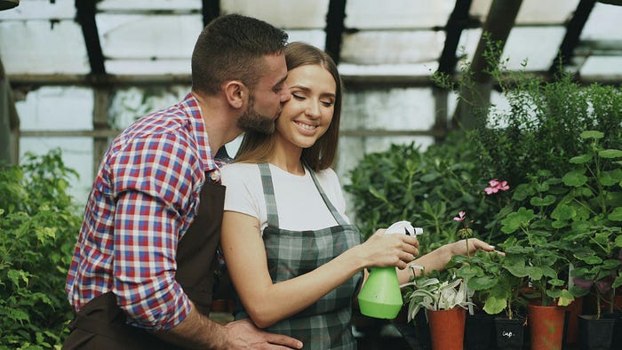 Happy couple gardening together